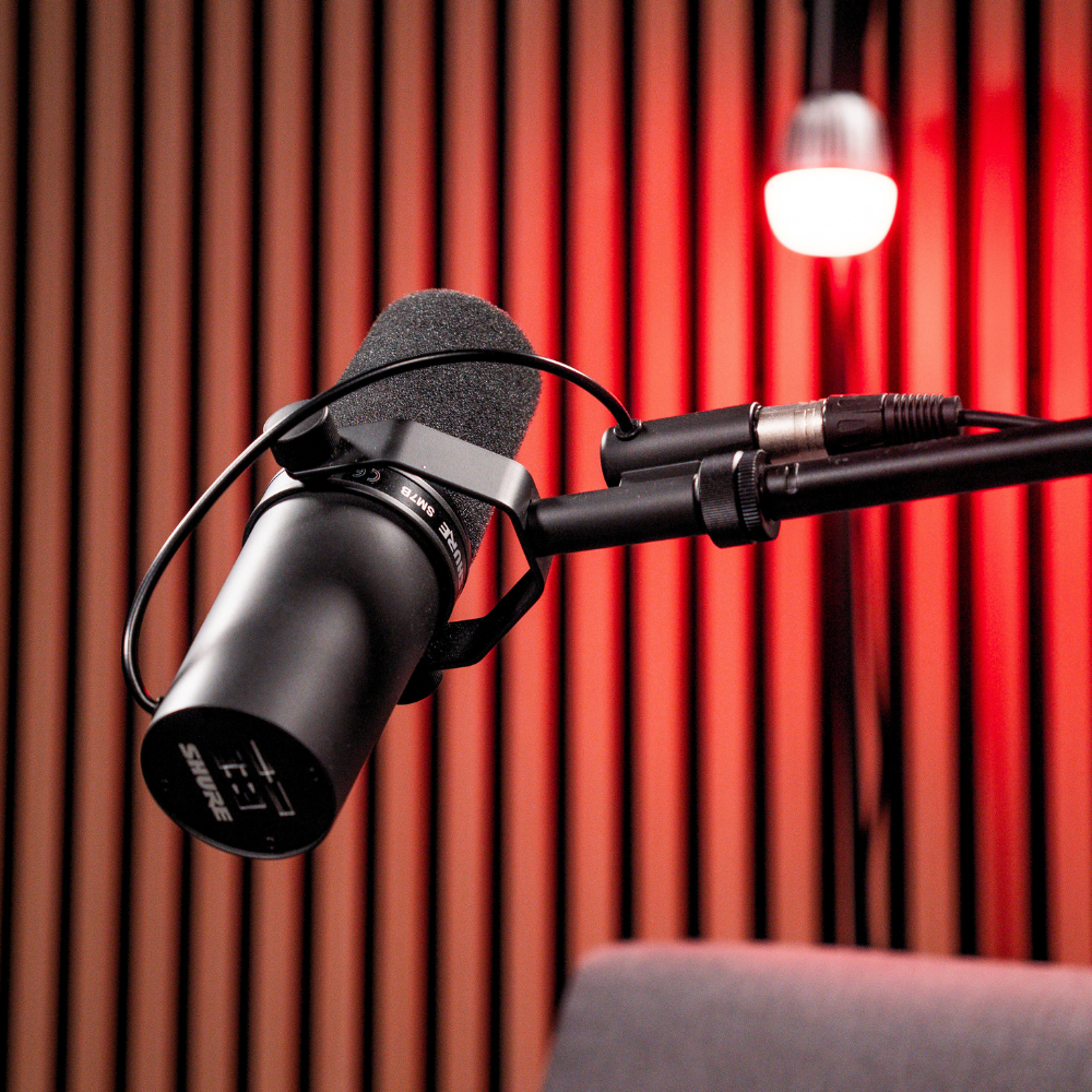 Studio microphone under red lighting at Empire Studios